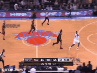 A Basketball Game Is Being Played Between The New York Knicks And Miami Heat GIF