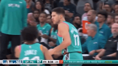 A Basketball Game Is Being Played Between The Spurs And The Wizards GIF