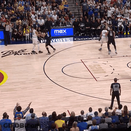 A Basketball Game Is Being Played In A Ball Arena GIF