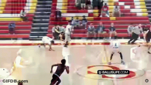 A Basketball Game Is Being Played In A Gym With A Ballislife.com Logo On The Court GIF