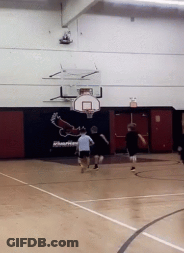 A Basketball Game Is Being Played In A Gym With A Riverhead Logo On The Wall GIF