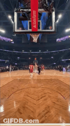 A Basketball Game Is Being Played In A Stadium That Is Sponsored By State Farm GIF