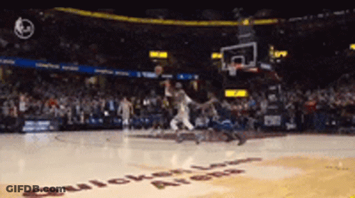A Basketball Game Is Being Played In A Stadium That Says Quicken Loans On The Floor GIF