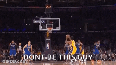A Basketball Game Is Being Played In A Stadium With A Crowd Watching . GIF