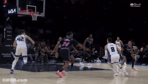 A Basketball Game Is Being Played In A Stadium With A Kia Sign In The Background GIF