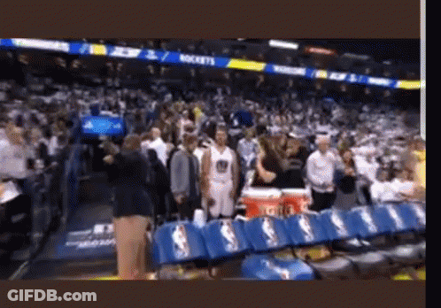A Basketball Game Is Being Played In A Stadium With A Lot Of People GIF