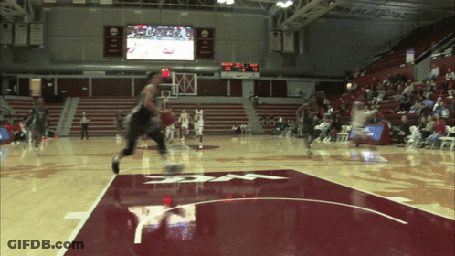 A Basketball Game Is Being Played In A Stadium With A Scoreboard That Says ' Ucsd ' On It GIF