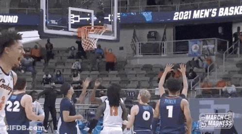 A Basketball Game Is Being Played In A Stadium With A Sign That Says 2021 Men 'S Basket GIF