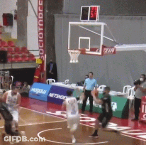 A Basketball Game Is Being Played In A Stadium With A Sign That Says " Netshoes " On It GIF