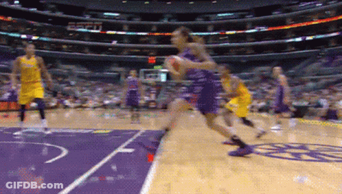 A Basketball Game Is Being Played In A Stadium With Espn On The Wall GIF