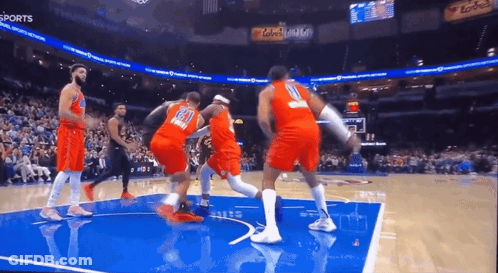 A Basketball Game Is Being Played In A Stadium With The Word Sports On The Bottom GIF