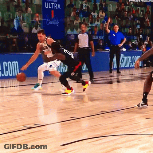 A Basketball Game Is Being Played In Front Of A Banner For Ultra GIF