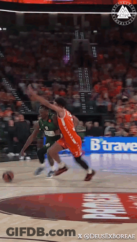 A Basketball Game Is Being Played In Front Of A Banner That Says Bravae GIF