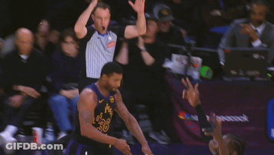 A Basketball Game Is Being Played In Front Of A Banner That Says Nbc Peacock GIF
