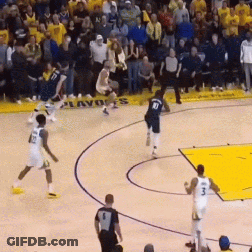 A Basketball Game Is Being Played In Front Of A Banner That Says ' Playoffs ' On It GIF