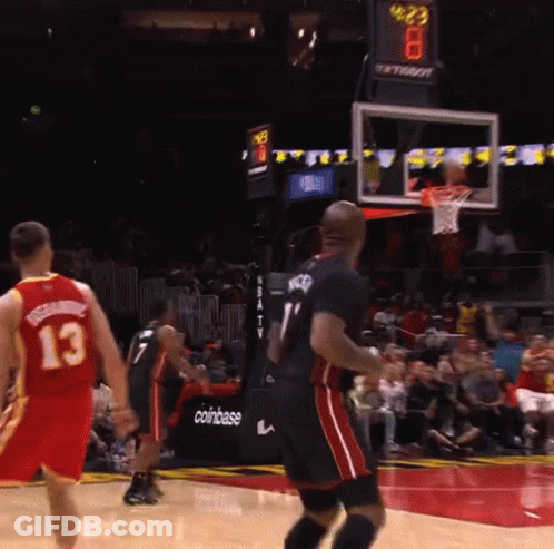 A Basketball Game Is Being Played In Front Of A Coinbase Sign GIF
