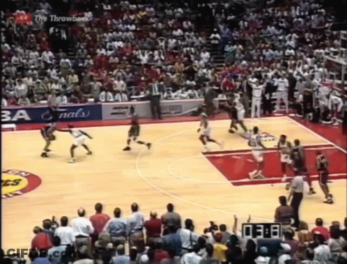 A Basketball Game Is Being Played In Front Of A Crowd And A Scoreboard That Says 3:08 GIF