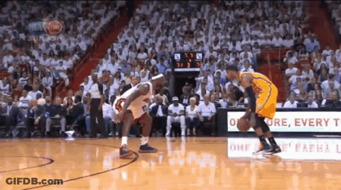 A Basketball Game Is Being Played In Front Of A Crowd And A Sign That Says " Every T " GIF