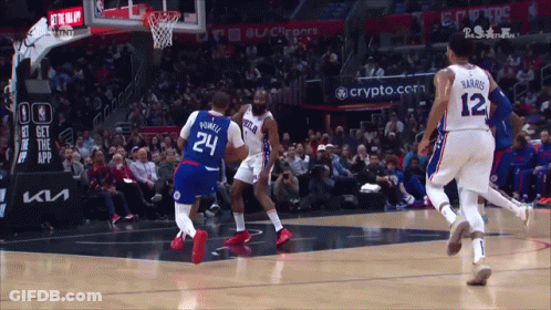 A Basketball Game Is Being Played In Front Of A Crowd And A Sign That Says Get The App GIF