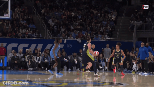 A Basketball Game Is Being Played In Front Of A Crowd And A Sign That Says ' Nba Live ' GIF