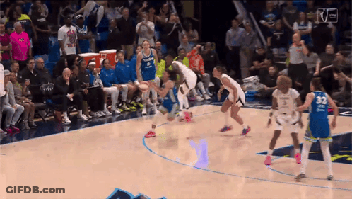 A Basketball Game Is Being Played In Front Of A Crowd And The Number 32 Is On The Back Of A Player GIF
