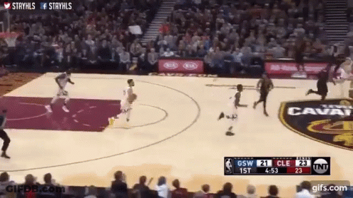 A Basketball Game Is Being Played In Front Of A Crowd And The Score Is 21 To 23 GIF