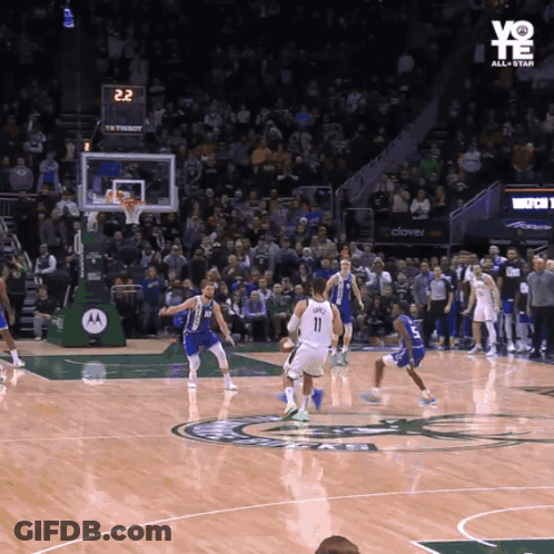 A Basketball Game Is Being Played In Front Of A Crowd And The Scoreboard Says 22 GIF