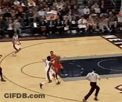 A Basketball Game Is Being Played In Front Of A Crowd GIF