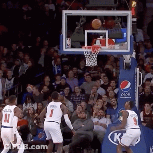 A Basketball Game Is Being Played In Front Of A Crowd Of People Sponsored By Pepsi GIF