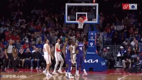 A Basketball Game Is Being Played In Front Of A Crowd Sponsored By Ktl GIF
