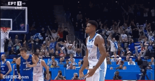 A Basketball Game Is Being Played In Front Of A Crowd That Is Cheering For Their Team GIF