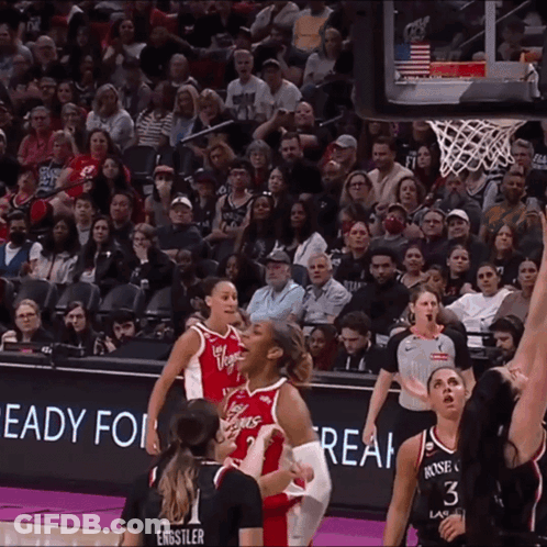 A Basketball Game Is Being Played In Front Of A Crowd That Is Ready For Real GIF