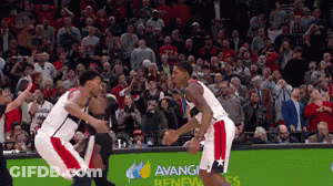 A Basketball Game Is Being Played In Front Of A Crowd That Is Sponsored By Avanti GIF