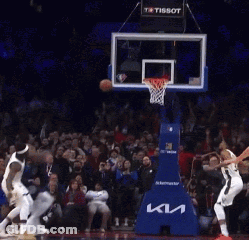 A Basketball Game Is Being Played In Front Of A Crowd That Is Sponsored By Tissot GIF
