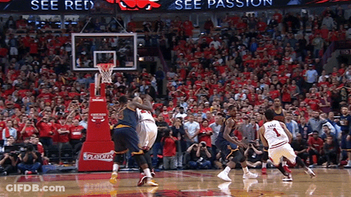 A Basketball Game Is Being Played In Front Of A Crowd That Is Wearing Red GIF