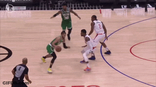 A Basketball Game Is Being Played In Front Of A Crowd That Says Les Te GIF
