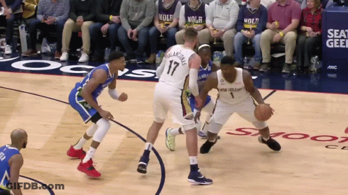 A Basketball Game Is Being Played In Front Of A Crowd Wearing Nolh Jerseys GIF