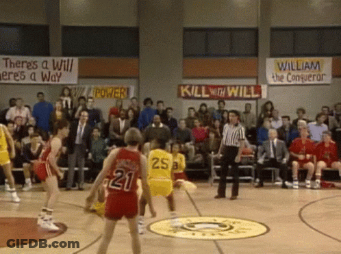 A Basketball Game Is Being Played In Front Of A Crowd With A Banner That Says Kill With Will GIF