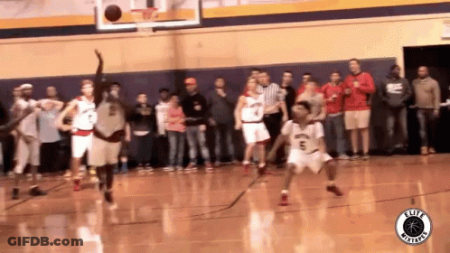 A Basketball Game Is Being Played In Front Of A Crowd With A Logo For Elite Basketball GIF