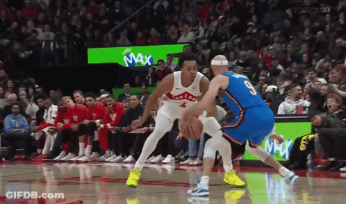 A Basketball Game Is Being Played In Front Of A Crowd With A Max Advertisement In The Background GIF