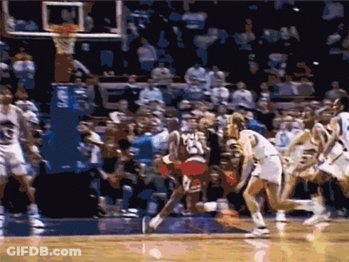 A Basketball Game Is Being Played In Front Of A Crowd With A Player Wearing The Number 23 GIF