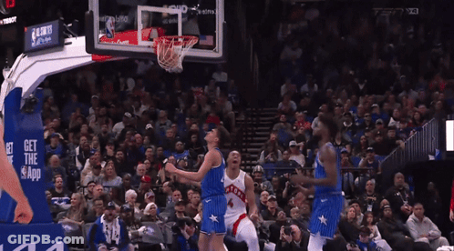 A Basketball Game Is Being Played In Front Of A Crowd With A Sign That Says Get The App GIF