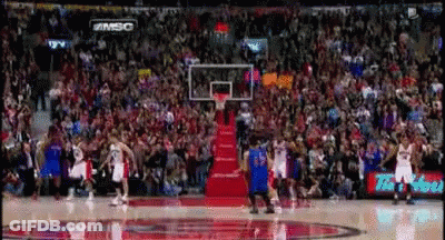 A Basketball Game Is Being Played In Front Of A Crowd With A Sign That Says #Msc On It GIF
