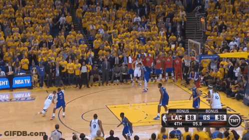 A Basketball Game Is Being Played In Front Of A Crowd With A Tnt Advertisement GIF