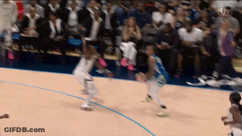 A Basketball Game Is Being Played In Front Of A Crowd With A Tnt Logo In The Corner GIF