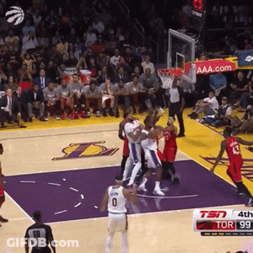 A Basketball Game Is Being Played In Front Of A Crowd With A Tsn Sign In The Background GIF