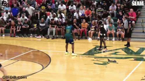 A Basketball Game Is Being Played In Front Of A Crowd With The Number 30 On The Player 'S Jersey GIF