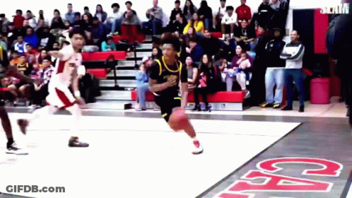 A Basketball Game Is Being Played In Front Of A Crowd With The Word Cal On The Floor GIF