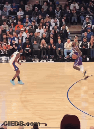 A Basketball Game Is Being Played In Front Of A Crowd With The Word Chase On The Court GIF