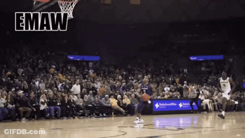 A Basketball Game Is Being Played In Front Of A Crowd With The Word Emaw On The Bottom GIF